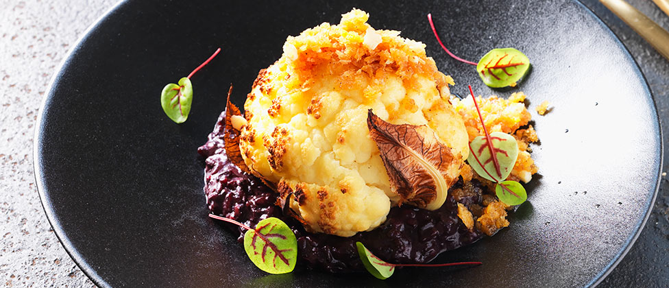 Roasted baby cauliflowers with polonaise and Venere risotto