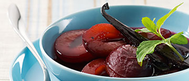Plums in red wine