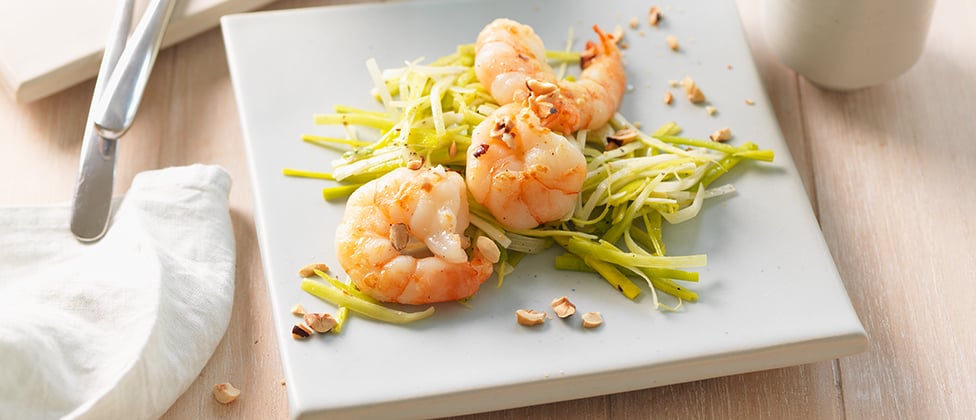 King prawns with nut butter on a bed of leek salad