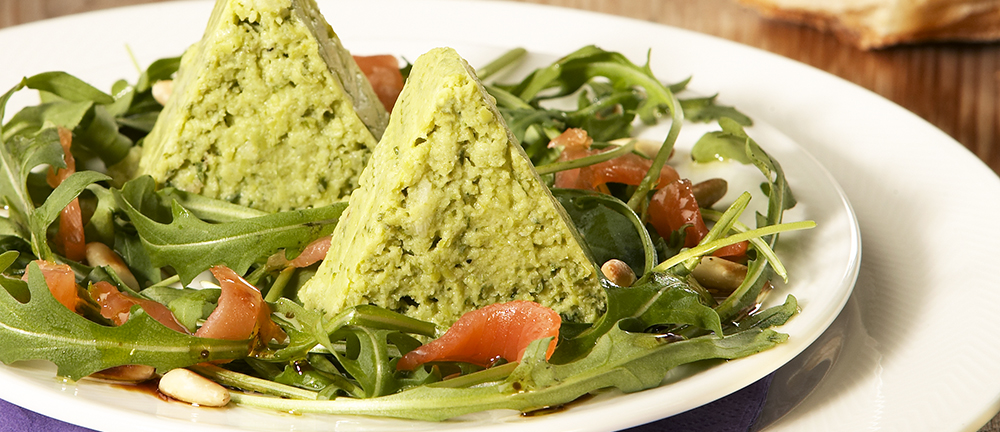 Pea terrine on a bed of rocket