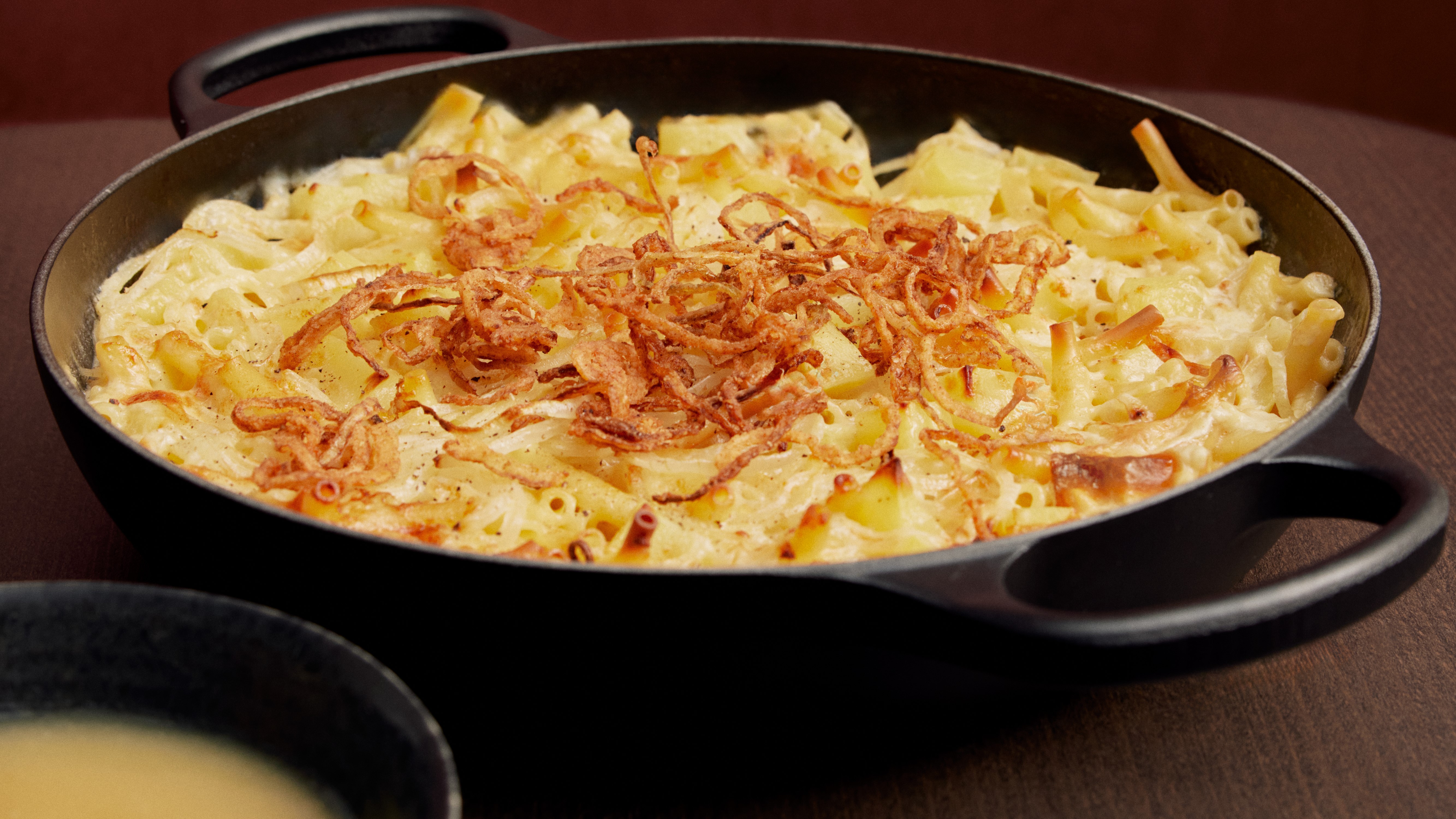 Älplermagronen (Swiss Alpine macaroni cheese) with apple purée and fried onions