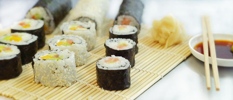 Sushi with salmon, cucumber, avocado and mango